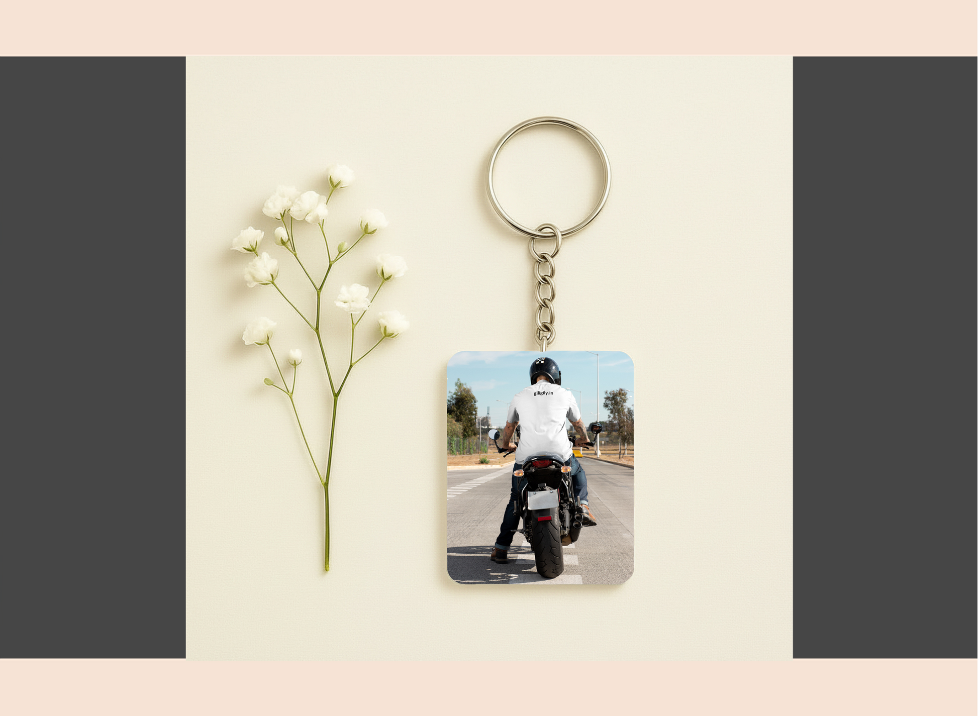 Keychain with photo of person on a motorcycle next to a small plant on a light background