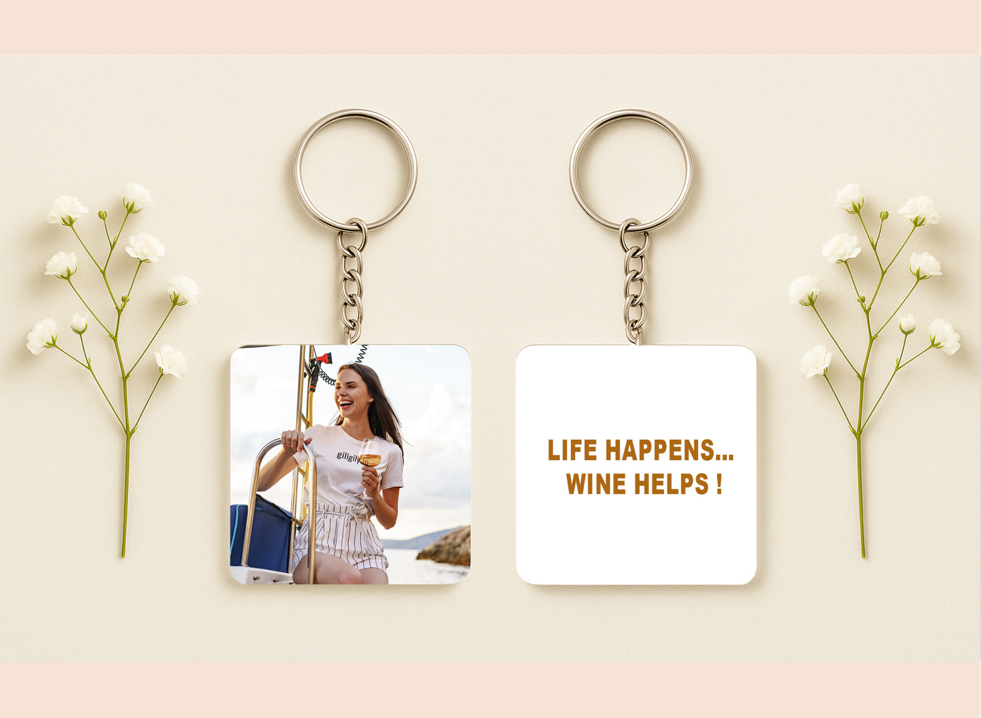 Two keychains with different designs on a light background with flowers.