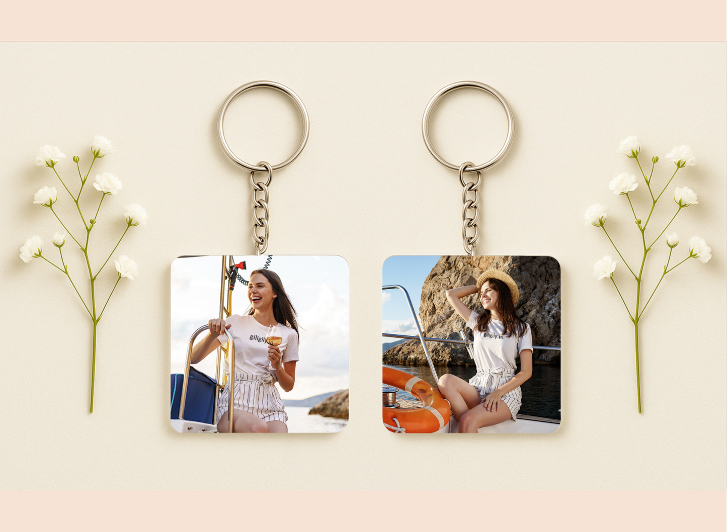 Two keychains with photos of a woman on a boat and at the beach, surrounded by small white flowers.
